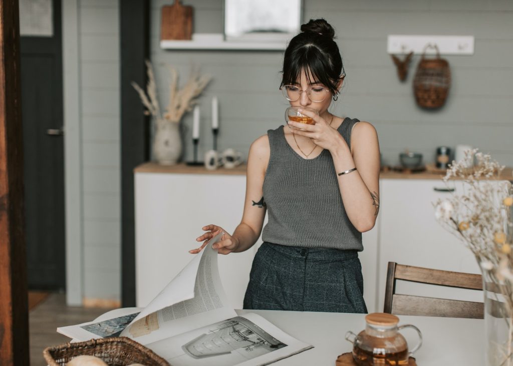 The lady is drinking tea